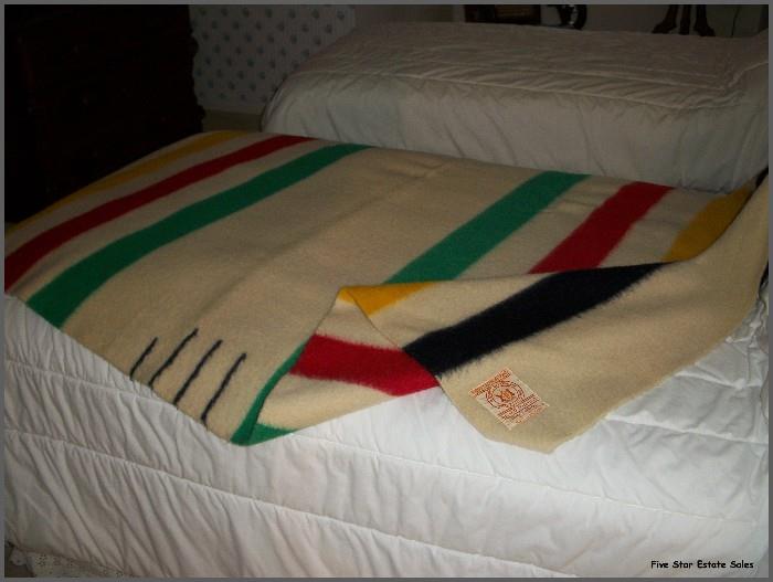 There are 4 Hudson Bay blankets in near- perfect condition.