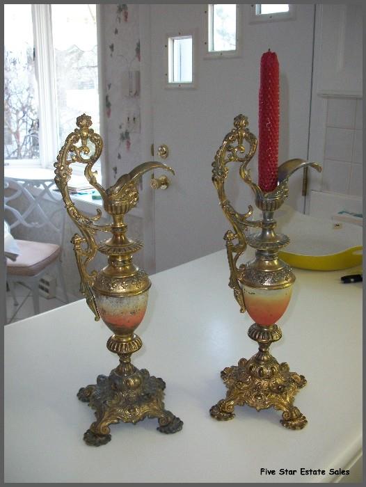 A pair of ornate brass candleholders.