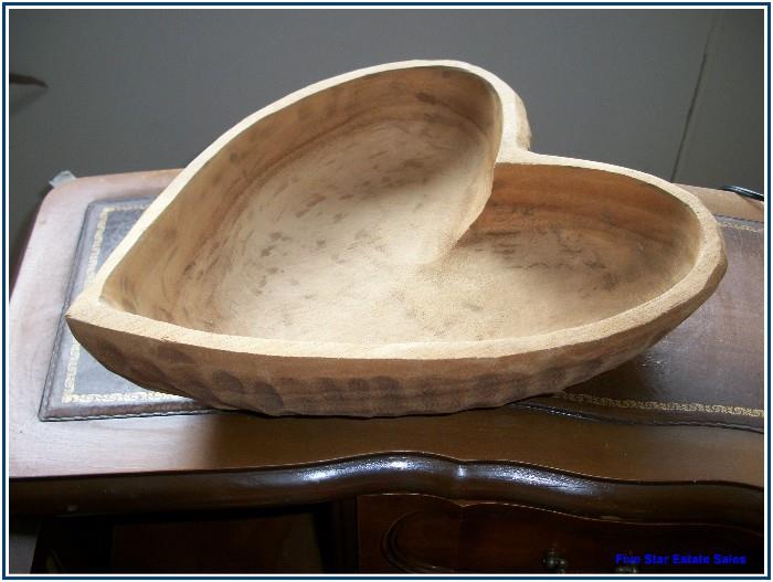 Hand- hewn bowl.