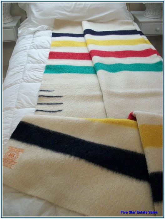There are 4 Hudson Bay blankets in wonderful condition.