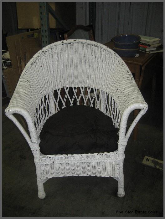 One of many antique wicker chairs