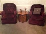 2 burgundy upholstered swivel/rocker chairs, and pecan octagonal side cabinet/table