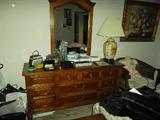 VINTAGE BEDROOM SUITE
Signed Dixie brand mahogany 
Nine drawer chest of drawers with attached mirror
