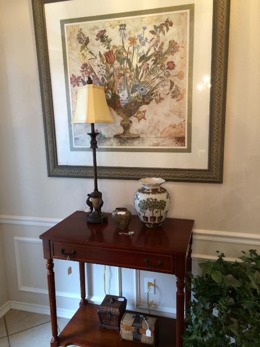              Entry table, lamp, framed picture, decor