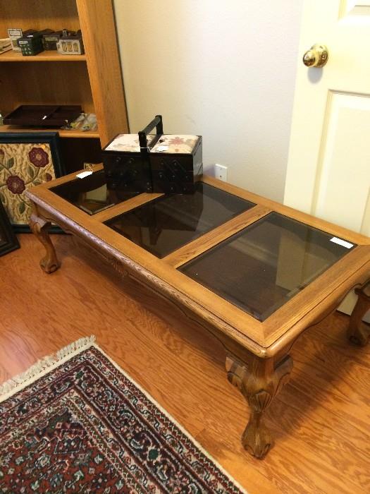          Coffee table has two matching end tables. 