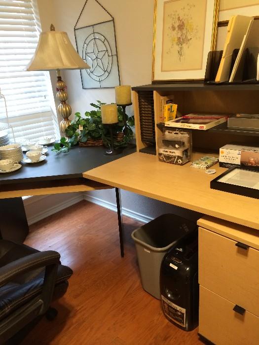                 Desk unit, lamp, and office supplies