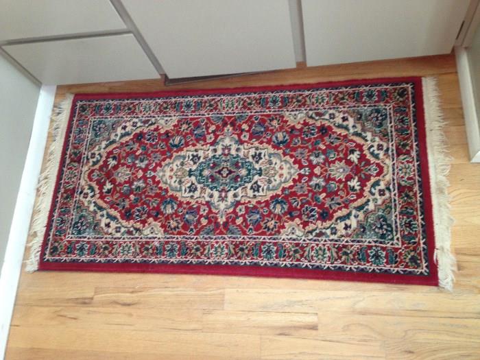 One of a pair of small area rugs perfect for an entry or kitchen