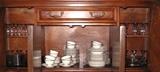 Lower portion of china cabinet showing the rest of china & crystal