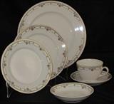 T K Thun China Czechoslovakia 6 piece Service Shown.  Dinner plates (11), Salad Plates (11), B&B Plates (11),  Dessert a Bowls (5), Cups (3),  Saucers (7).  Not shown: 1 Demitasse Cup & Saucer and (5 ) Matching Butter Pats Louis Srouss & sons Karlsbad Austria