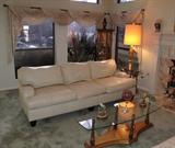 View of Bernhardt Leather Sofa (96"L x 36"D x 31"H) and Italian Regency Florentine Cocktail Table (60"W x 20"D).  Window treatments excluding rods will also be sold. 