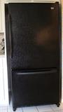 My tag black refrigerator/freezer. (69x 33x 32)