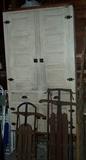 Top of large primitive cupboard - 39 1/2" W x 71" H x 12 1/2" D, 2 older sleds