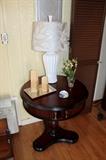 Round side table, contemporary lamp, and home decor