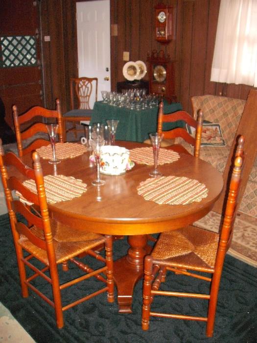 Rugs, Table with leaf and 4 ladder back chairs.