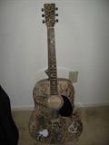 Duck Dynasty acoustic guitar.