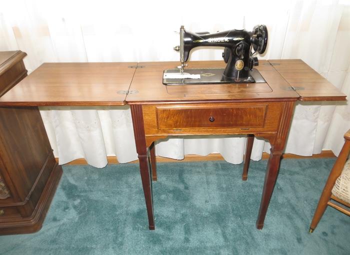Sewing cabinet. Vintage Singer sewing machine.
