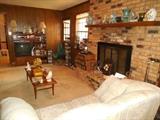 Family Room Danish modern tables, pottery, Love Seat,