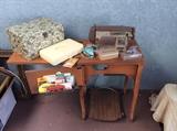 Vintage sewing machine and accessories. 
