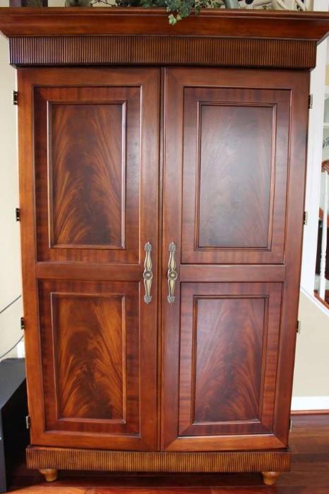 This stunning armoire is currently used as a media center.