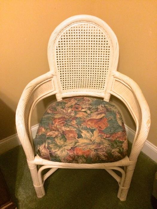 Two captain's chairs also go with round wicker dinette set