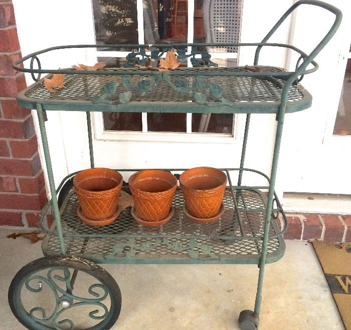 Green wrought-iron teacart on casters