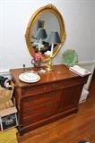 side board, candlestick lamp, oval mirror