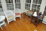 wicker rocker, table, chair