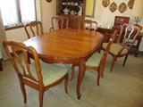 Dining set with self storing leaves, 6 chairs (2 are Captain's chairs) and table pads
