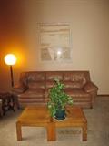 Leather couch with matching oak accent tables.  The lamp is not for sale