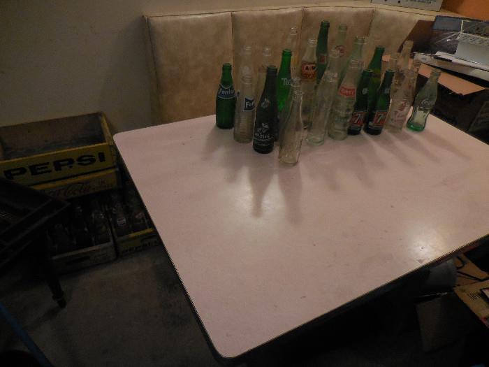 Vintage 1950's Pink Formica Table Top Metal Base. Booth Stye Bench Vintage Soda Bottles.