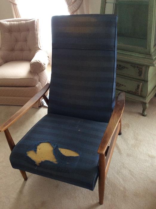 This Midcentury Modern recliner works beautifully. Just waiting to be recovered and you have something really special!
