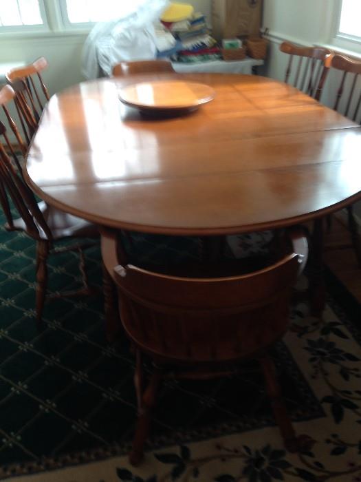 Heywood Wakefield Table with Four Leaves and six Winthrop Chairs  