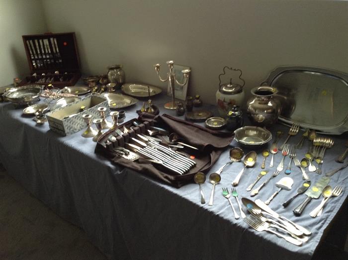 1 sets silver-plate flatware remains.  Dresser set, silver   Many one-of-a-kind serving utensils.