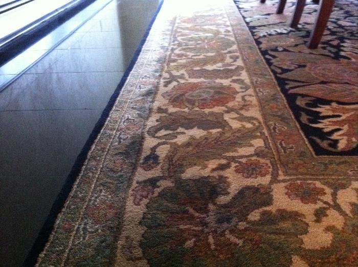 Stunning Ethan Allen black carpet with tan, green and burgundy floral design. plush and in mint condition. Dimensions approx 103 in width by 140 in length and 1 in high