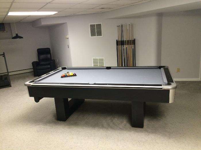 8-foot slate pool table with ball return, built-in score counter and full accessories. Recently re-felted, contemporary design, excellent condition