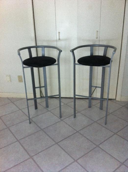 Very comfortable, very sturdy pair of kitchen counter or bar stools/chairs in excellent condition. Buffed steel grey finish with black upholstered seats