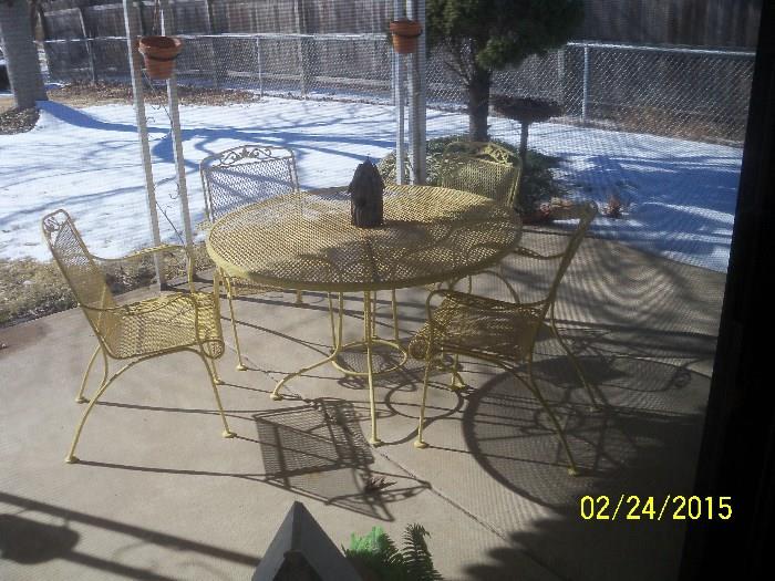 Yellow wrought iron patio set