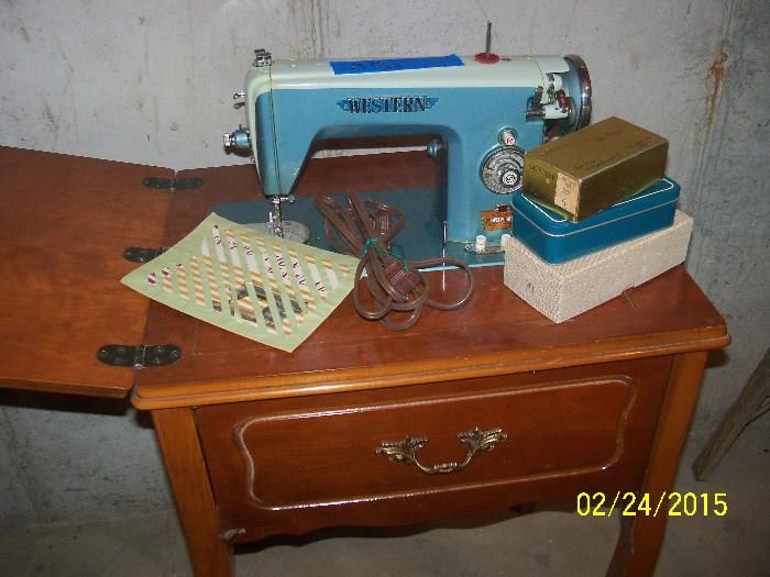 Western sewing machine with attachments and original booklet