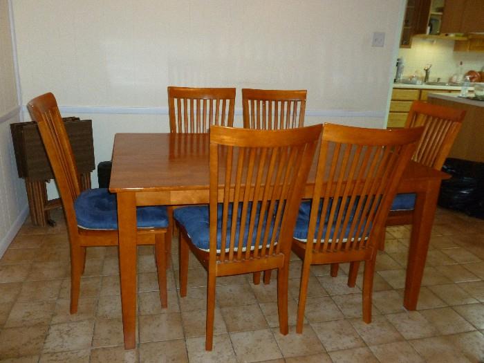 Unusual table w/6 chairs...opens lengthwise w/leaf to make a large square table