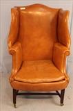 24 - 18th Century English wing chair, leather upholstery, 51 in. T, 31 in. W, 20 in. D.