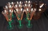 39 - Nine pieces pink depression glass, pitcher and glasses with pink twisted stems.