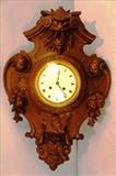 103 - American Victorian oak wall clock with north wind face, lots of carving, 28 in. T, 18 in. W.