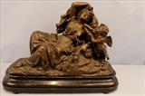 117 - Speller sculpture of lady and cupid, antique with good old label on bottom, 14 in. T, 22 W, 8 in. D.