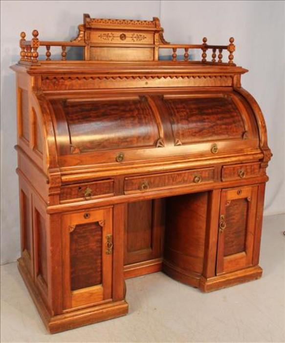 120 - Walnut Victorian  cylinder roll Wooten desk, signed with swing out doors.