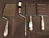 129 - Sterling cheese and cake cutters, 4 pieces, 8 in. L.