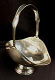 181 - Sterling silver basket with handle, 12 in. T, 9 in. W, 6 in. D.