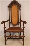 178 - Walnut fireside chair with cane back and pierced carved crown, 56T, 27W, 17D