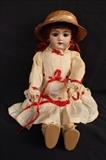 224 - German porcelain doll with hat and red ribbons (no damage) signed