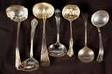 276 - Seven sterling serving ladles.