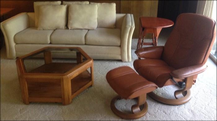 Ekornes Stressless Chair with Footstool in carmel-colored leather upholstery. The patented Stressless function allows you to change sitting positions without having to resort to handles or levers. Awesome!